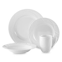 white dinnerware set on a white background