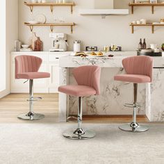 two pink barstools sit in front of a marble counter with shelves above it