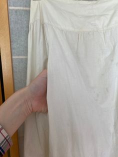 "Late 1800's white cotton skirt with crocheted hem. Has many many stains, on the hem and body of the skirt. Being sold as is Waist: 25.5\" Waist to hem: 38\"" Cotton Petticoat With Gathered Skirt For Daywear, Vintage Petticoat For Summer Daywear, Victorian Cotton Petticoat For Daywear, Vintage Cotton Dresses With Lined Skirt, Vintage Cotton Petticoat For Daywear, White Lined Cotton Petticoat, White Regency Style Cotton Petticoat, White Cotton Victorian Dress For Summer, White Cotton Lined Petticoat