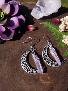 "Witchy moon earrings featuring a 40mm silver moon and wirewrapped lavender ab coated quartz crystals in the center. These are very lightweight and dainty. ➳ Total length is 2\" ➳ Silver ear wires are stainless steel and suitable for those with allergies. ➳ All components are tarnish resistant, lead & nickel free You may also like: https://www.etsy.com/listing/1033282062/quartz-earrings-moon-earrings-celestial https://www.etsy.com/listing/1033276034/boho-earrings-quartz-earrings-moon ̩̩͙✩*̩̩ Crystal Car Charms, Boho Mirror, Lavender Earrings, Lotus Earrings, Hippie Earrings, Silver Moon, Bohemian Earrings, Black Earrings, Moon Earrings