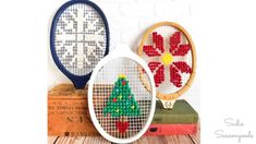 two tennis racquets with beaded designs on them, one in the shape of a christmas tree