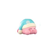 a small toy pig with a blue hat on it's head and eyes closed