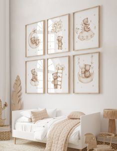 a white bedroom with four framed teddy bears on the wall above the bed, along with other furniture and decor