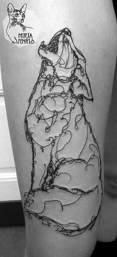 a black and white photo of a person's leg with a tattoo on it