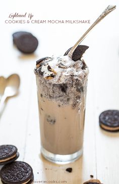 an ice cream sundae with oreo cookies on the side