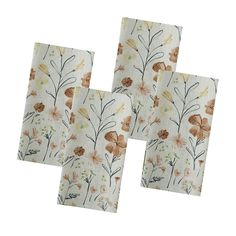 four napkins with floral designs on them