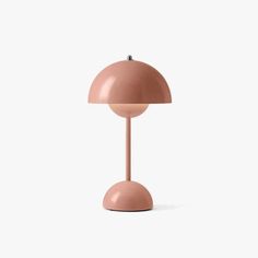 a pink table lamp on a white background