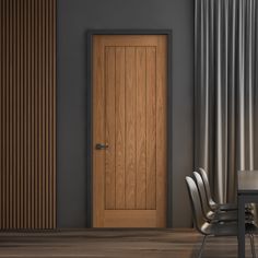 an empty chair sits in front of a wooden door with vertical slats on the wall