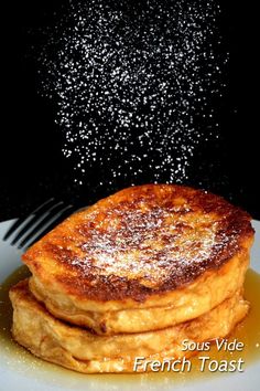 french toast on a plate with powdered sugar sprinkled over the top and bottom