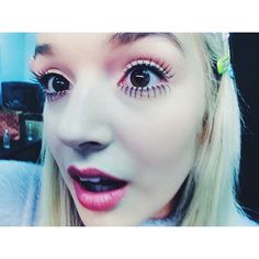 a close up of a person with fake eyelashes