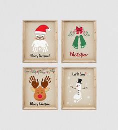 four framed christmas cards with hand prints and santa's hats on the top one