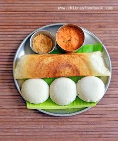 a plate that has some food on top of it and sauces in small bowls