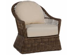 a wicker chair with a white cushion