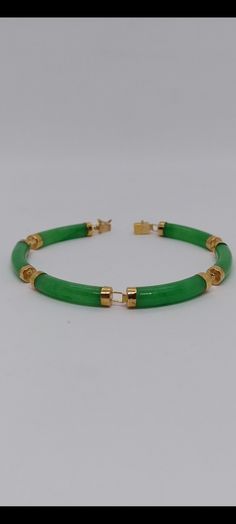 14K Yellow Gold Green Jade Curved Link Bracelet. Six Green Jade link section Curved Jade Bracelet in 14k yellow gold for her and for him. Bracelet Info: - Gemstone: Green jade, - Bracelet length: 7 Inches / Bracelet width: 5 Millimeters - Materials: Yellow Gold - Finished: 14k - Nice gift box Included. Green Bangle Bracelet For Anniversary, Green Bangle Bracelets For Anniversary, Classic Green Bangle Jewelry, Formal Yellow Gold Jade Bracelets, Formal Yellow Gold Jade Bracelet, Elegant Green Round Gold Bracelet, Elegant Green Gold Round Bracelet, Green Jubilee Bracelet For Anniversary, Green Bangle Bracelet For Formal Occasions