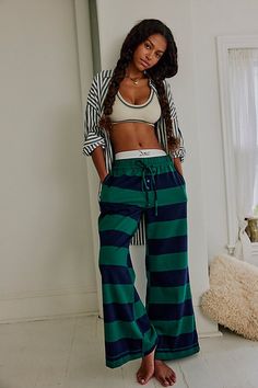 We’re living in these comfy cotton lounge pants from Intimately, featured in a flared silhouette with wide stripes and an adjustable waistband for endless wear in or out of the house. **Fit:** Relaxed, flared, mid-rise **Features:** Comfy cotton fabrication, wide stripes, elastic waistband with adjustable drawcord, button-fly details **Why We | You Wish Flare Pants by Intimately at Free People in Blue, Size: M Striped Cotton Sweatpants For Loungewear, Striped Cotton Lounge Bottoms, Striped Cotton Loungewear Bottoms, Green Cotton Bottoms For Lounging, Striped Relaxed Fit Bottoms For Lounging, Green Cotton Loungewear Bottoms, Green Cotton Lounging Bottoms, Striped Wide Leg Loungewear Bottoms, Blue Striped Pants