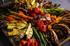 a platter filled with different types of vegetables