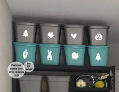 the shelves are filled with plastic buckets and other items for halloween decorations on them