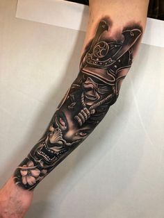 a man's arm with some tattoos on it