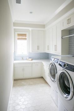 a washer and dryer in a white laundry room