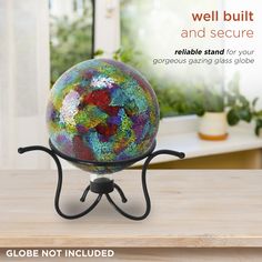 a glass globe sitting on top of a wooden table