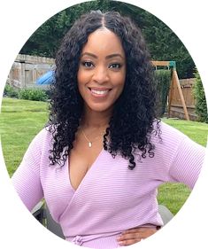 a woman with curly hair wearing a purple top and smiling at the camera in a circle