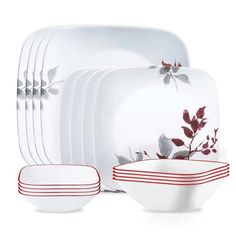 a set of white dishes with red stripes