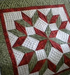 a green and red quilted table topper