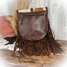 Maddie Purse Product Details - Width 9" - Height 9" - Depth 3.5" - Strap - Inside is fully lined with 1 zipper closure pocket and 1 pouch style pocket - Back has 1 zipper closure pocket - Genuine leather Fall Pouch Bag With Leather Handles, Pouch Bags With Leather Handles For Fall, Cactus Western, Western Bag, Western Purses, Western Boutique, Purse Clutch, Backpack Purse, Ohio