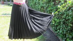 "This pretty pleated skirt vintage is perfect for spring, autumn and summer! DETAILS: rare skirt vintage skirt made in West Germany skirt midi pleated skirt fabric: wool;  polyester color: black side zipper almost circle skirt skirt with lining Very good condition. Measurements lying flat are: Length: 28,5\" / 72cm Waist: 14\" / 35,5cm PLEASE NOTE: \"Laying flat\" means that waist  NEED TO DOUBLED Estimated size: EUR42 / UK14, but refer to measurements  Belt in photo is not included." Black Accordion Pleated Skirt For Summer, Retro Black Pleated Skirt, Retro Black Skirt For Spring, Black Vintage Skirt For Summer, Vintage Black Skirt For Summer, Vintage Black Skirted Bottoms, Retro Black Long Skirt, Vintage Pleated Lined Skirt For Spring, Spring Vintage Flared Pleated Skirt