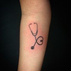 a tattoo with a stethoscope on the arm