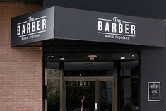 the barber shop is located in an old brick building