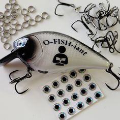 an assortment of fishing lures and eyeglasses on a table