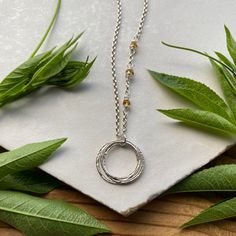 This elegant necklace offers up a unique combination of playfulness & timeless style. Three organically shaped & uniquely textured sterling silver circles layer gracefully on a lovely sterling silver double cable chain. Each ring is handcrafted individually to represent your journey through the decades. Circles are hammered flat & strong, and given a rustic sparkly texture. Three gemstones are intricately wrapped on the chain, creating a lovely birthstone accent. Choose from 15 gemstones! (Gems Circular Jewelry With Adjustable Chain For Gift, Adjustable Full Circle Jewelry Gift, Adjustable Necklace For Gift, Adjustable Birthstone Necklace For Anniversary, Hammered Spiritual Necklaces With Adjustable Fit, Spiritual Hammered Adjustable Necklace, Adjustable Hammered Spiritual Necklaces, Sterling Silver Birthstone Necklace With Adjustable Chain For Anniversary, Minimalist Birthstone Necklace With Adjustable Chain