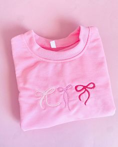 Girlies Bows Embroidered Sweatshirts / Neck crew Sweaters Girls / Adults  * Front design:  Three bows - original Pampanitas design. (the sizing of the design will be proportional to the size of the t-shirt). * Available colors:    - White Sweater    - Pink Sweater     * Sweater / details:      * Gildan Brand Cotton      * Crewneck      * Long Sleeve      * Solid Color      * 50% Cotton / 50% Polyester      * Available sizes: - Baby    - 6 moths    - 12 moths    - 18 months  - Toddlers    - 2T   - 3T   - 4T   - 5T - Youth:   - Extra Small    - Small   - Medium   - Large   - Extra Large - Adult:   - Small   - Medium   - Large   - Extra Large IMPORTANT - PLEASE READ MAINTENANCE INSTRUCTIONS    * Turn the T-shirt inside out before washing and drying.   * Machine wash cold with similar colours. Cute Sweatshirt Designs, Girly Sweatshirt, Sweaters Girls, Embroidered Sweaters, Sweater Details, Girls Sweatshirts, Pink Sweaters, Bow Sweater, Drying Machine