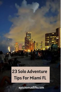 people sitting on the beach at night with buildings in the background and text reading 23 solo adventure tips for miami fl