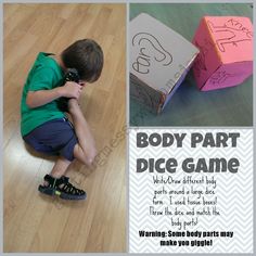 a young boy sitting on the floor next to a cardboard box with writing on it