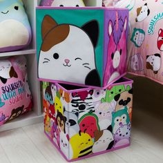 three colorful storage bins with cartoon animals on them