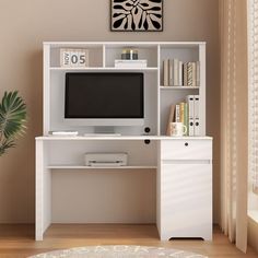 a white desk with a computer monitor and bookshelf next to a plant in a room