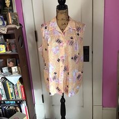 "Vintage 1970's sleeveless blouse. In a floral abstract style. The label is *EXTRA*. Tagged a size 46. See measurements below. *SCROLL DOWN FOR CONDITION & MEASUREMENTS* CONDITION: No issues noted. MEASURES:  (Tagged size 46) Bust~46\" Bottom at hem~52\" Back of collar to bottom~26\" *WE APOLOGIZE~BUT WE CAN NO LONGER SHIP TO GERMANY, ITALY OR SPAIN. IF ORDERS COME IN FROM GERMANY, ITALY OR SPAIN, WE WILL HAVE TO CANCEL THEM AND REFUND YOUR MONEY. SORRY FOR THIS INCONVENIENCE*" Retro Sleeveless Summer Blouse, Retro Sleeveless Blouse For Summer, Retro Summer Blouse For Vintage Fashion, Retro Blouse For Summer Vintage Fashion, Vintage Sleeveless Printed Tops, Patterned Sleeveless Blouse For Spring, Retro Summer Blouse With Vintage Print, Sleeveless Vintage Print Tops For Summer, Sleeveless Top With Vintage Print For Summer