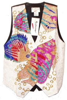 This sequin vest is handmade, high quality, original design and beautiful. Sequin vests are suitable for party, events or any occasional use. All sequin vests close with snaps in the front and the back is solid black with a strap to adjust the vest to your desired fit. Embellished Sleeveless Party Vest, Embellished Sleeveless Vest For Party, Sequined Fitted Vest For Spring, Fitted Sequin Vest For Spring, Fitted Sequin Party Vest, Fitted Sequined Vest For Party, Fitted Sequin Vest For Parties, Fitted Sequin Vest For Party Season, Fitted Sleeveless Vest For Festival