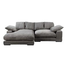 a gray couch with pillows on top of it