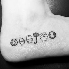 a black and white photo of a foot with the word tattoo written in different languages