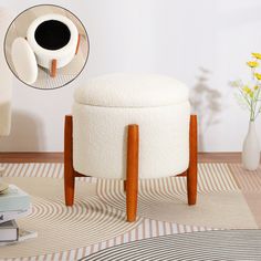 a white ottoman sitting on top of a rug next to a vase with flowers in it