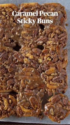 caramel pecan sticky buns on a baking sheet with the title above it