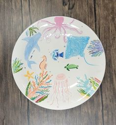 a plate with sea animals painted on it