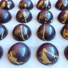 some chocolates with gold paint on them