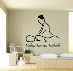 a bedroom with a wall decal that says relax, renn, refresh