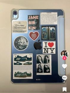 an ipad with stickers and pictures on the back cover that says i love new york