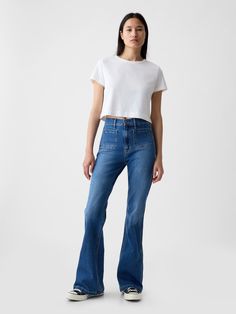 Fit: Snug & flattering through the hip & thigh with a flared leg. ​ Fabric: 86% Cotton, 13% Recycled Materials, 1% Stretch.  Stretch: Stretch Jeans.  A bit of hug & a lot of hold.  Comfortable & designed to flatter.  Rise: High Rise Jeans.  Look: A four-pocket jean in a medium indigo wash.  Details: Zip fly, front & back patch pockets.  Responsibly Made: This pair of jeans is part of our water-saving Washwell program.  Compared to conventional wash methods, Washwell has saved millions of liters Gap Flare Jeans, Flare High Waisted Jeans, Patch Pocket Jeans, Bar Clothes, Flare Jeans Outfit, Toddler Jeans, Water Saving, Gap Women, Summer 24