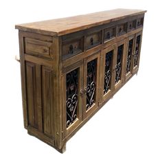 an old wooden sideboard with carvings on the doors and drawer fronts, isolated against a white background